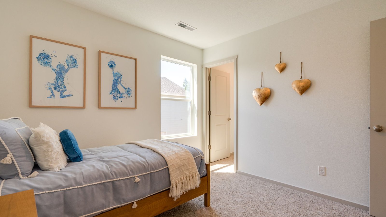 Bedroom with wall-to-wall carpet and a closet