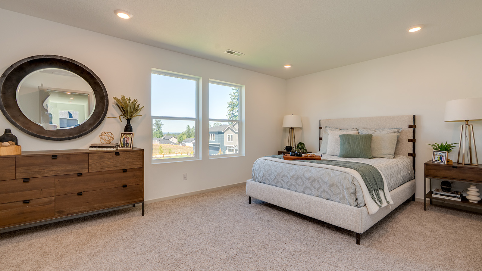 Primary bedroom with wall-to-wall carpet, a walk-in closet and an attached bathroom