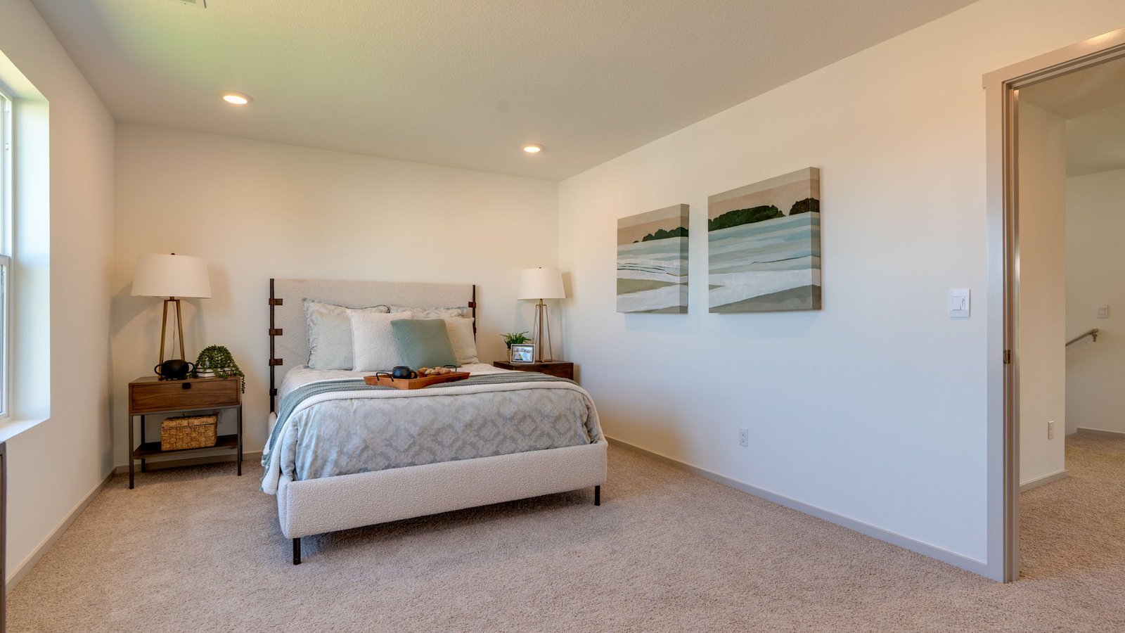 Primary bedroom with wall-to-wall carpet, a walk-in closet and an attached bathroom