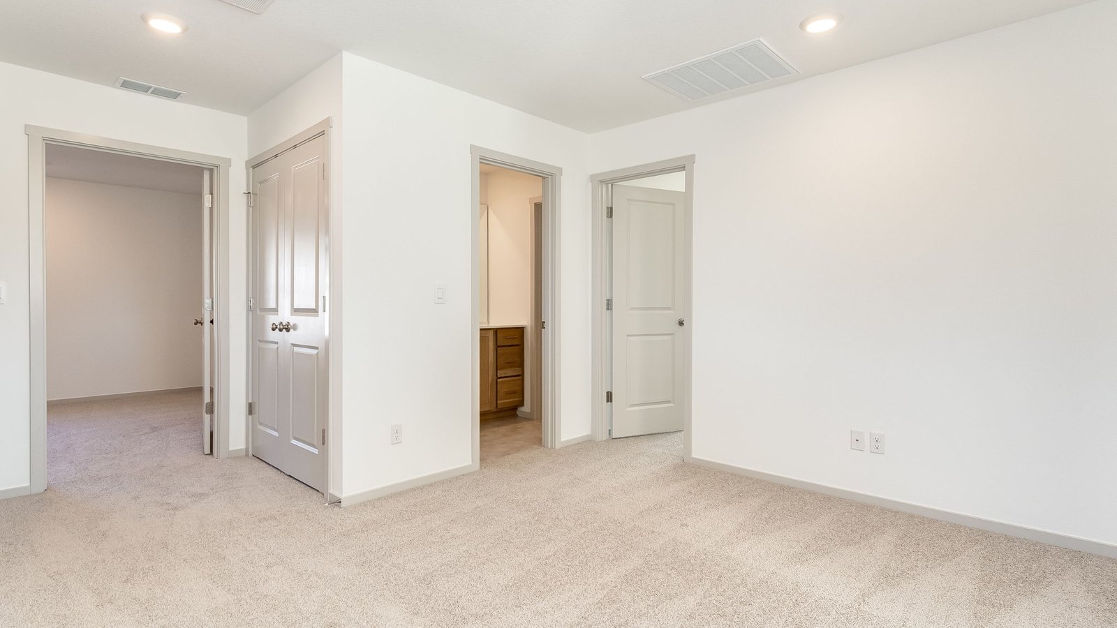 Hallway with wall-to-wall carpet