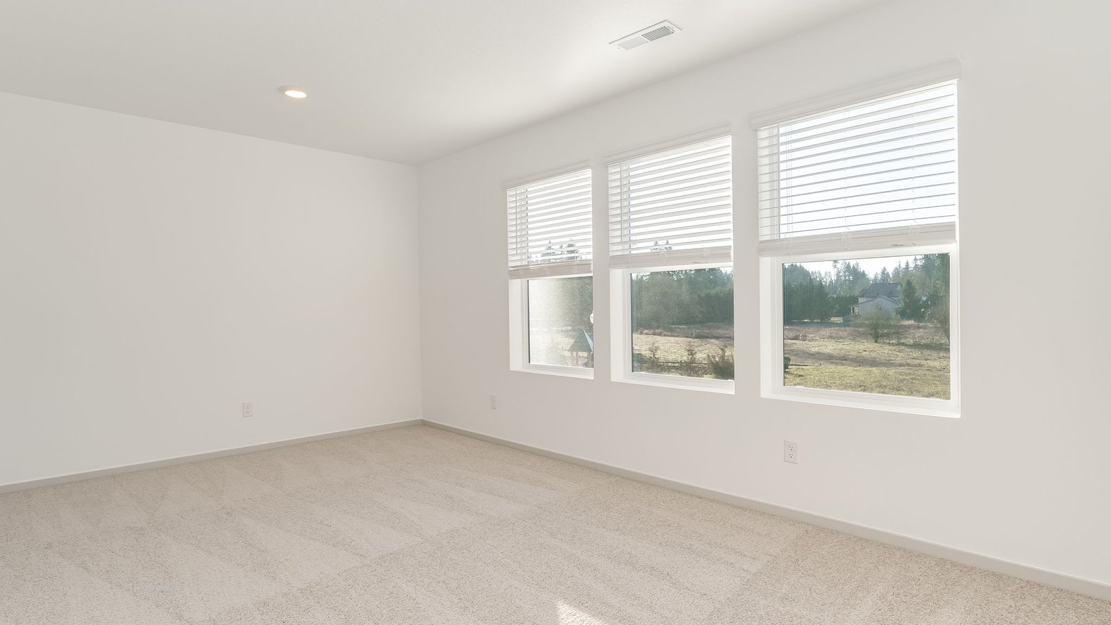 Bedroom with wall-to-wall carpet and a closet