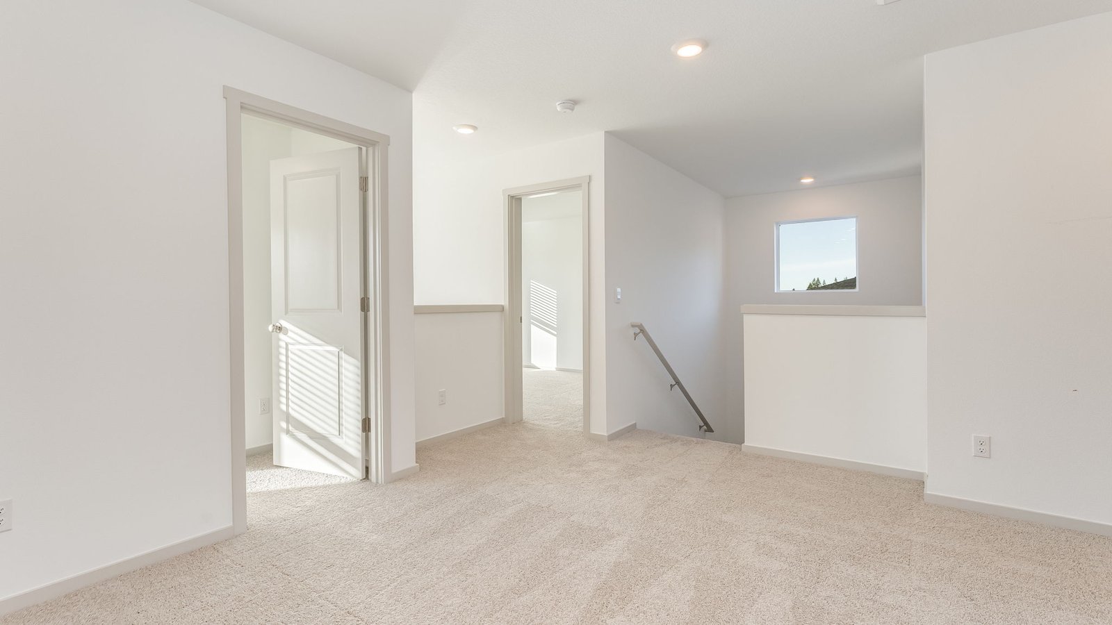 Hallway with wall-to-wall carpet