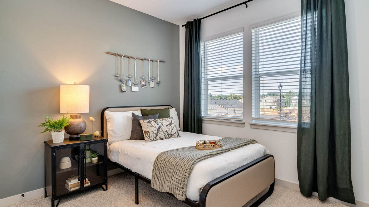 Bedroom with wall-to-wall carpet and a closet