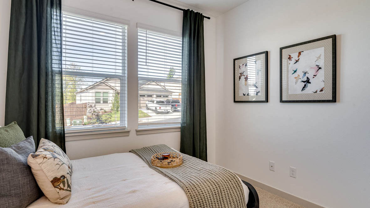 Bedroom with wall-to-wall carpet and a closet