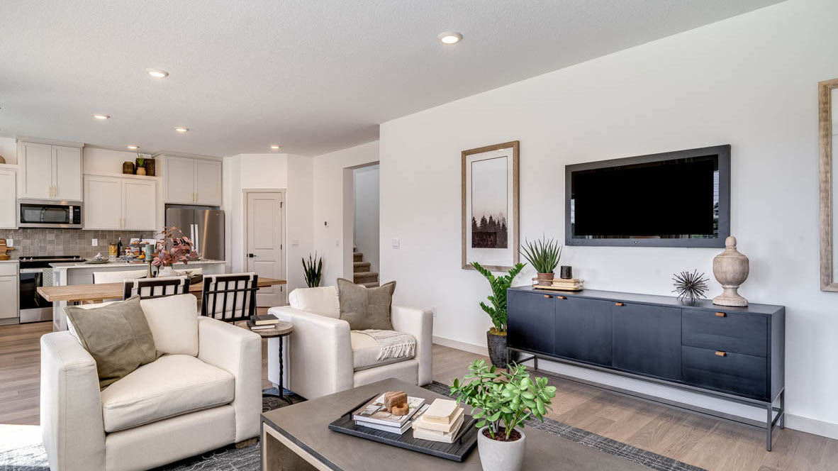 Great room with laminate flooring and an electric fireplace
