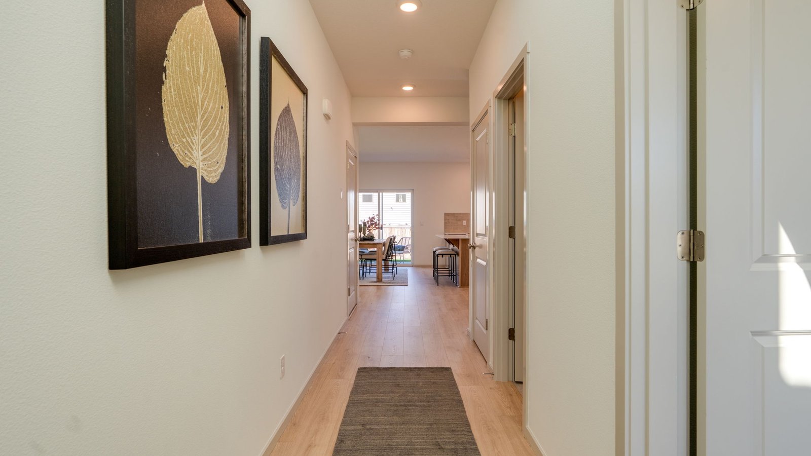 Entryway with a coat closet and laminate flooring