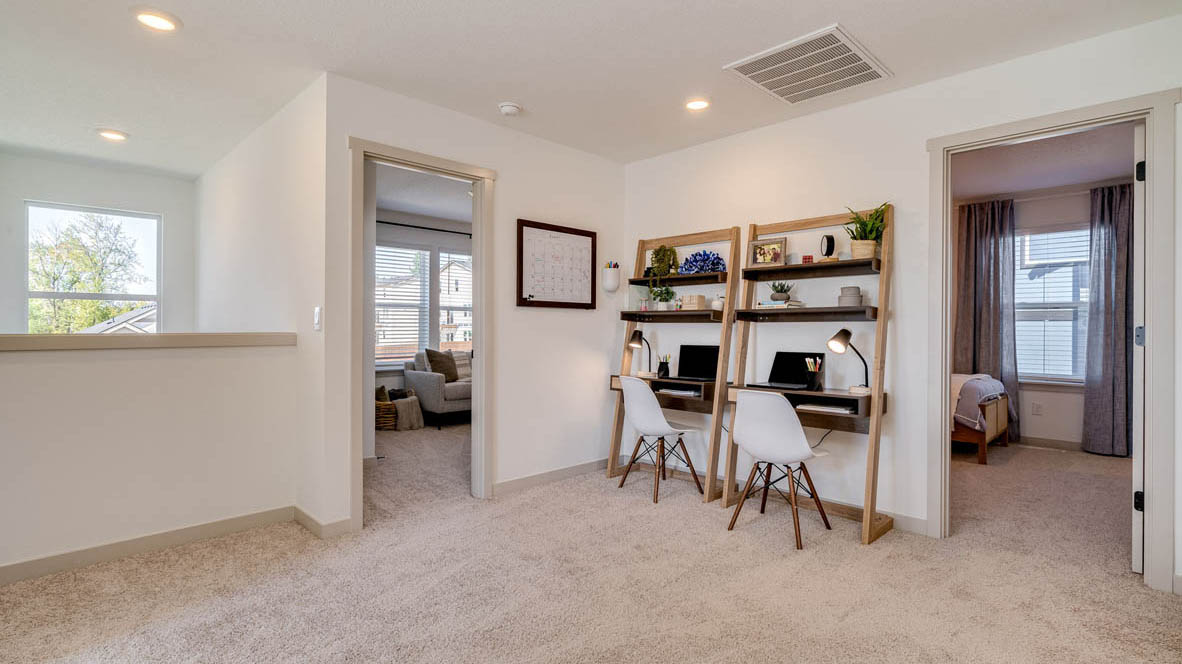 Hallway with wall-to-wall carpet