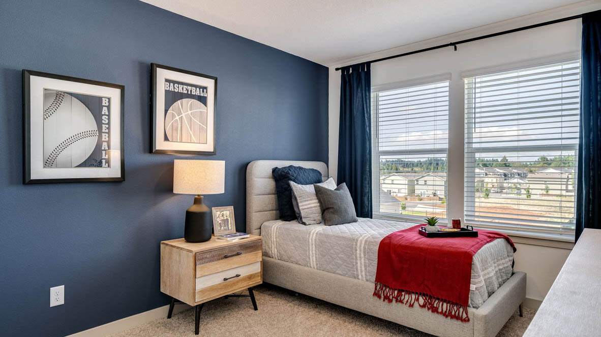 Bedroom with wall-to-wall carpet and a closet