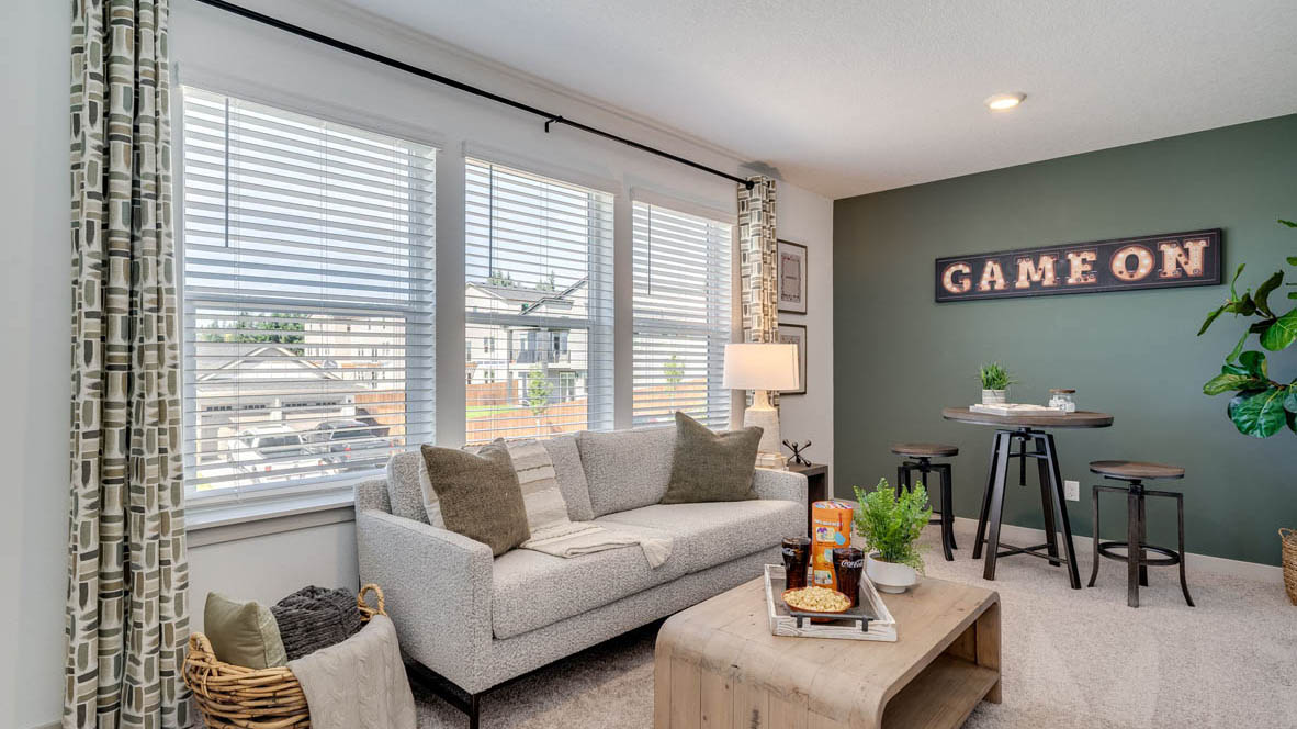 Bedroom staged as an office with wall-to-wall carpet and a closet