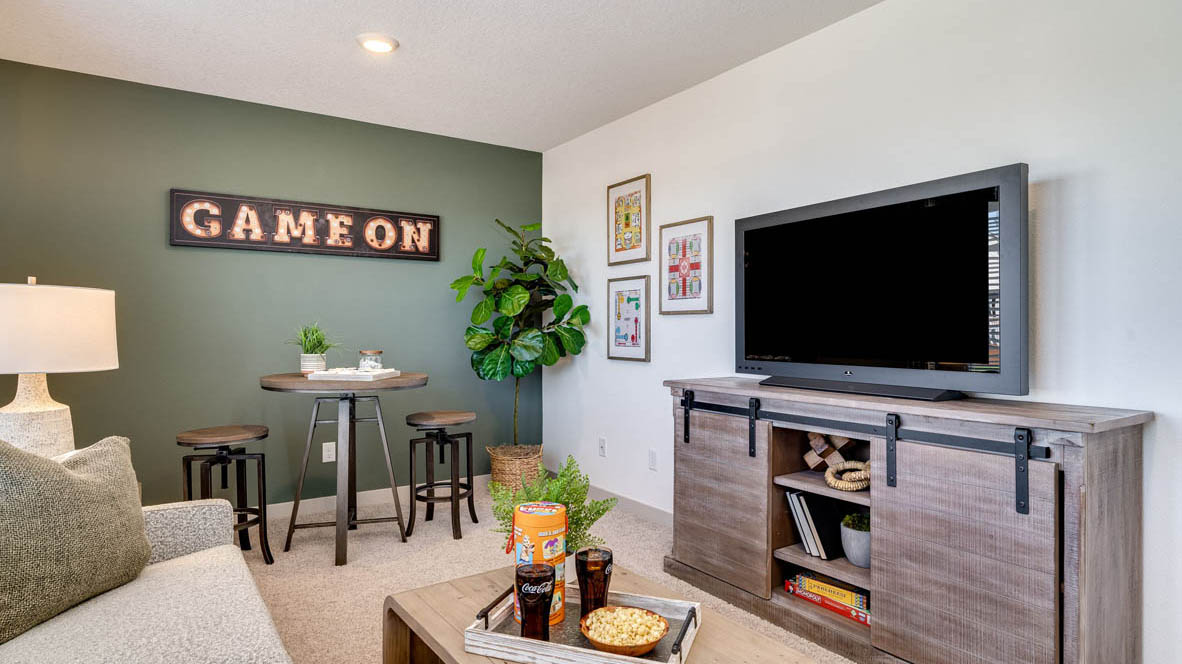 Bedroom with wall-to-wall carpet and a closet