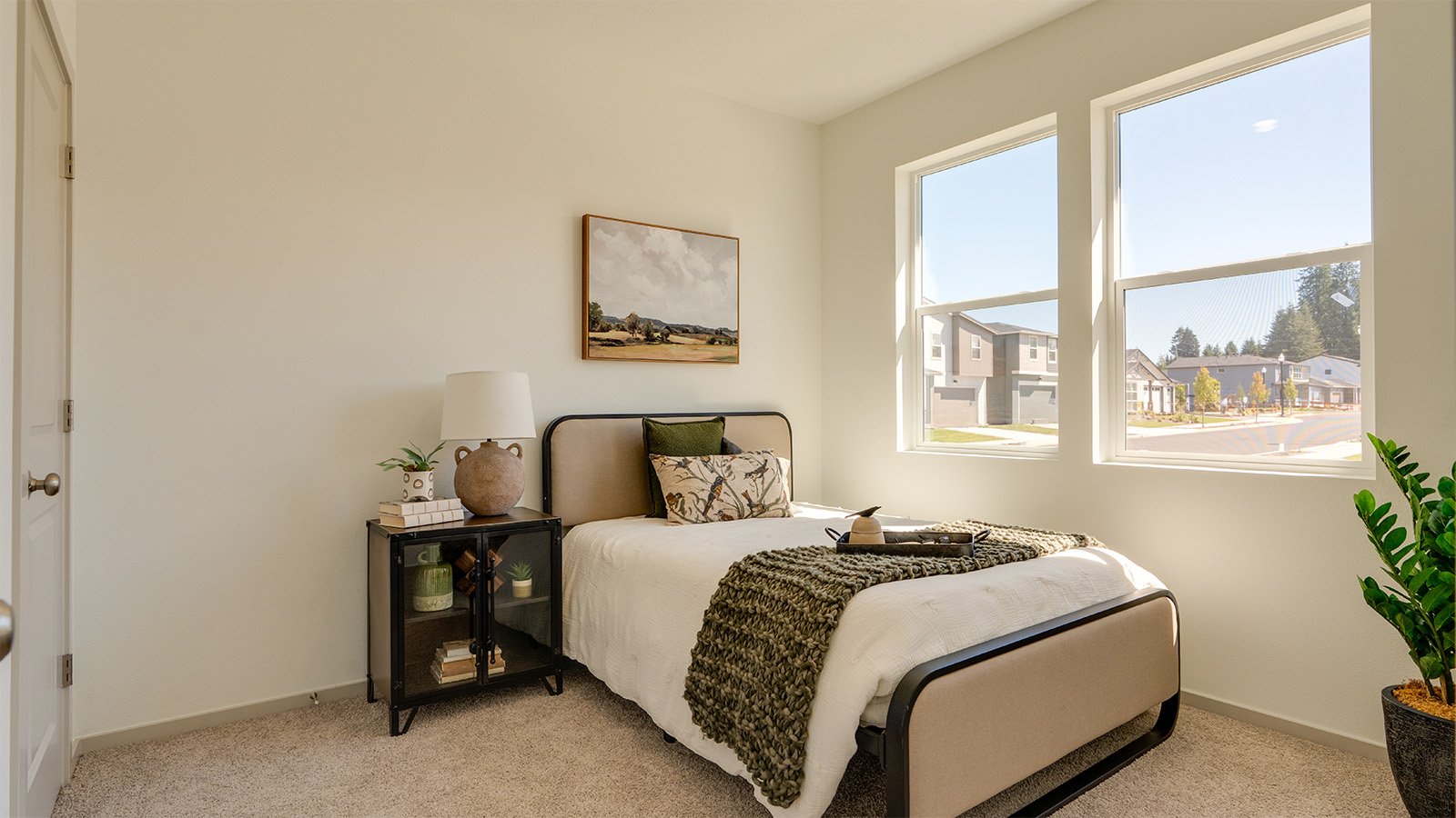 Bedroom with wall-to-wall carpet and a closet