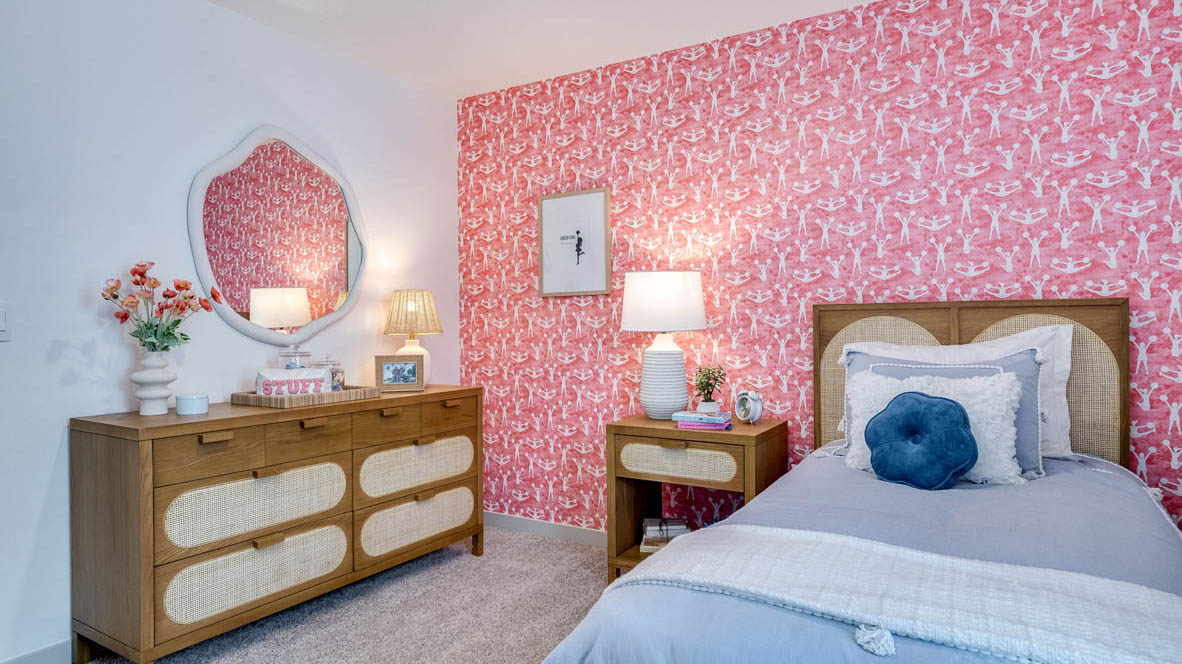Bedroom with wall-to-wall carpet and a closet