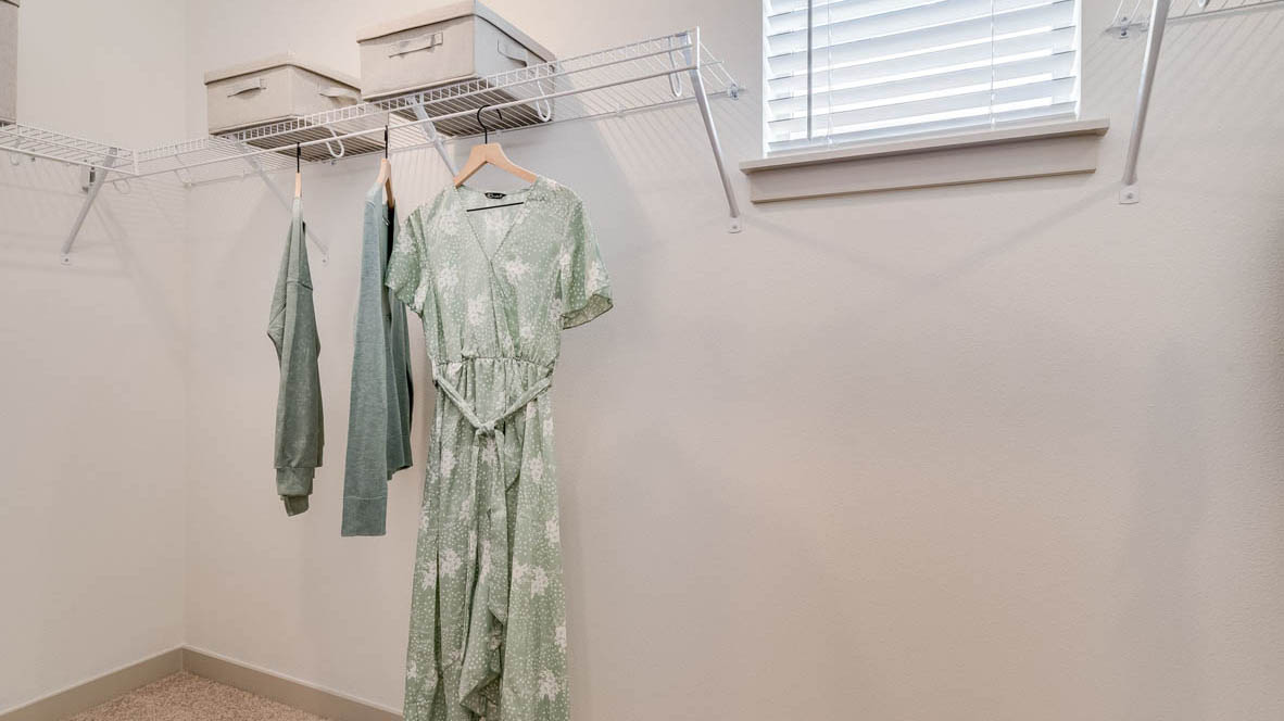 Primary bedroom walk-in closet with wire shelves