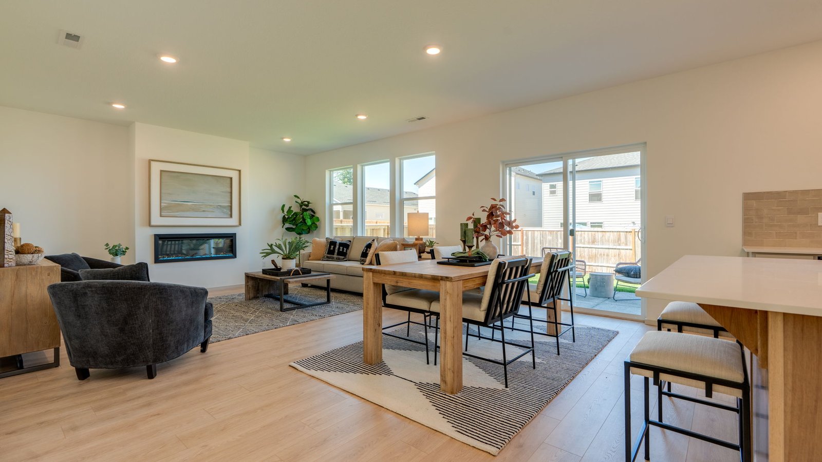 Great room with laminate flooring and an electric fireplace