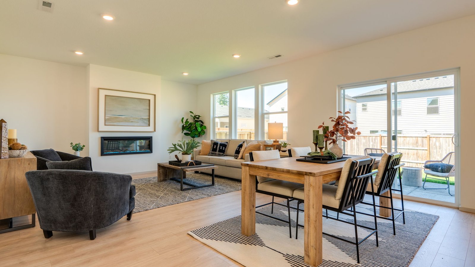 Great room with laminate flooring and an electric fireplace