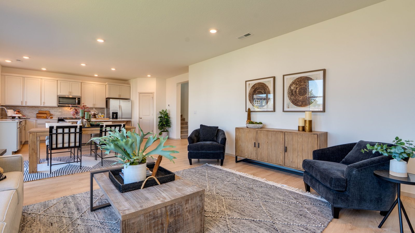 Great room with laminate flooring and an electric fireplace