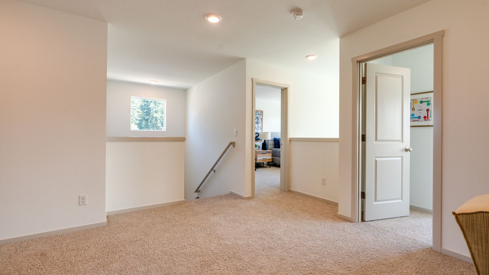 Hallway with wall-to-wall carpet