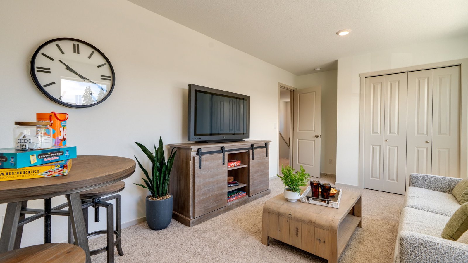 Bedroom with wall-to-wall carpet and a closet