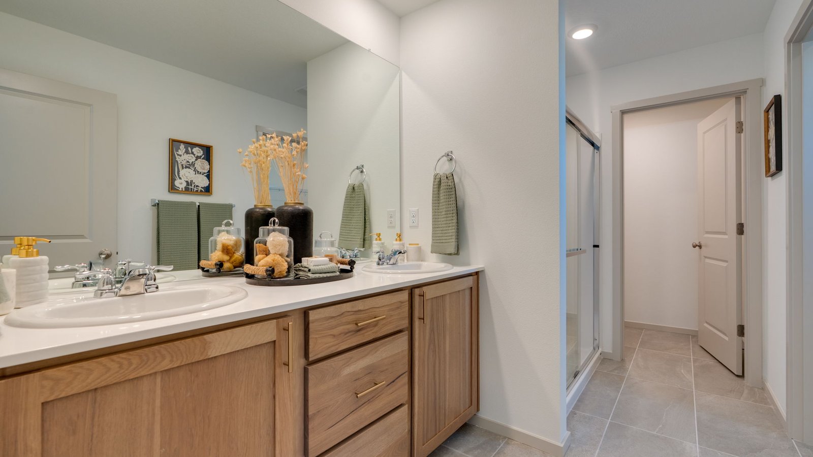 Primary bathroom with quartz counters and a walk-in shower