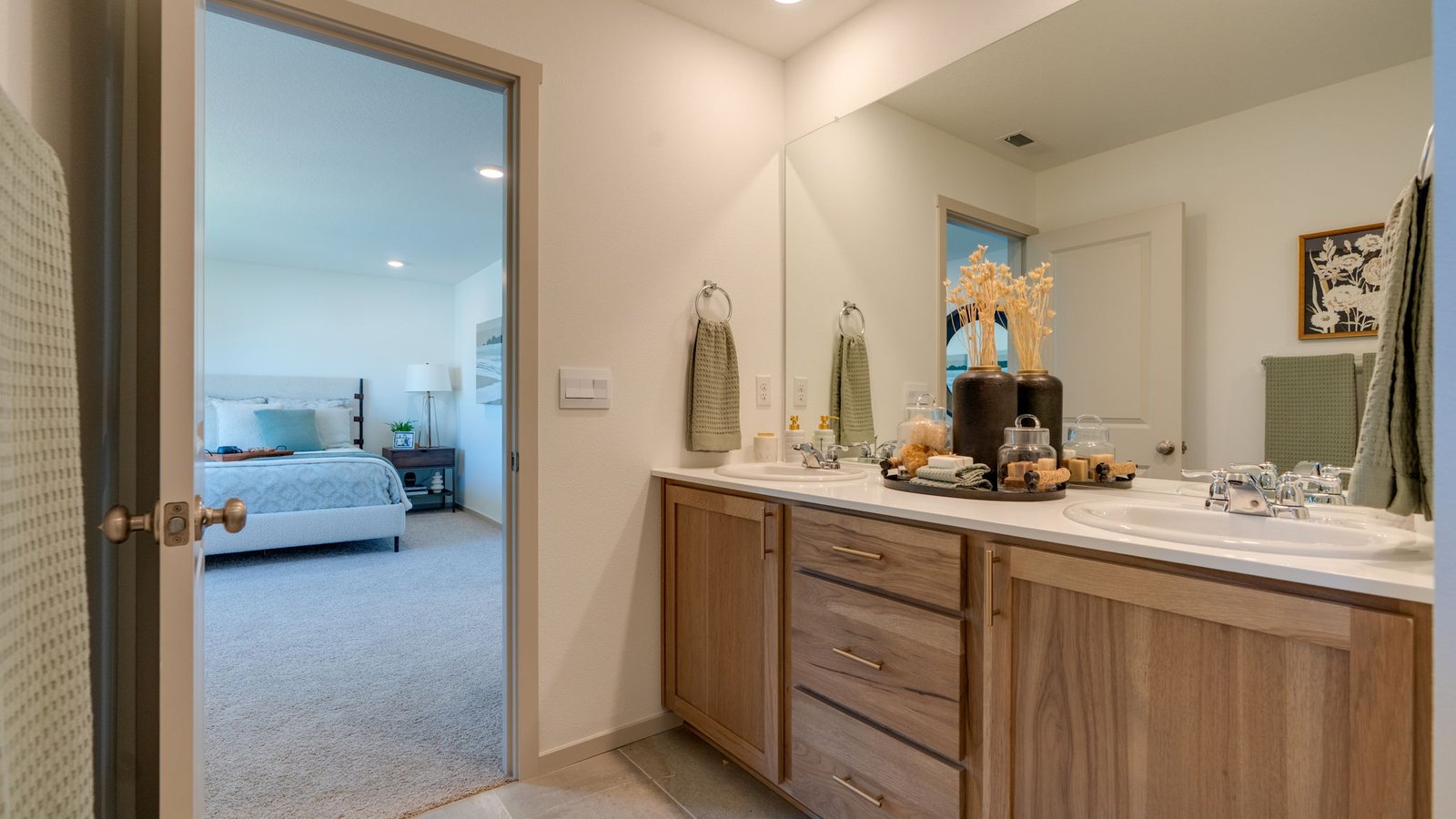Primary bathroom with quartz counters and a walk-in shower
