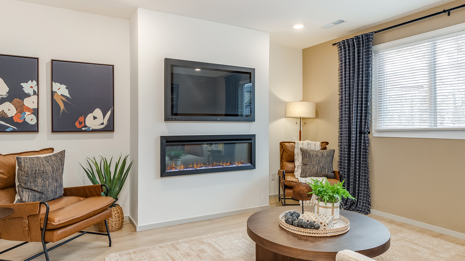 Great room with laminate flooring and an electric fireplace