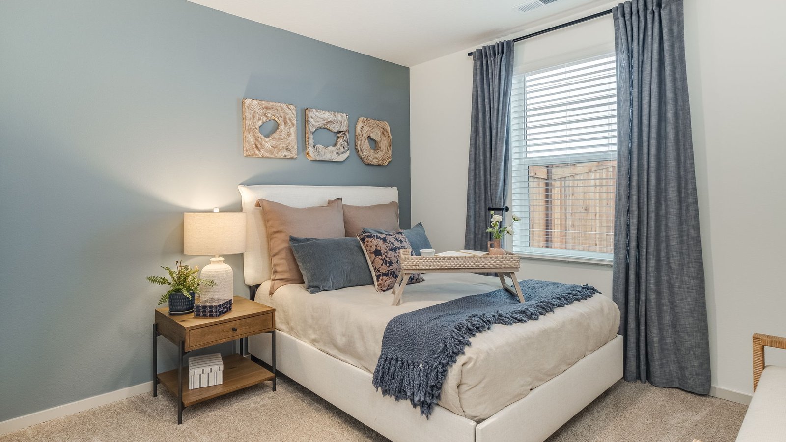 Bedroom with wall-to-wall carpet and a closet