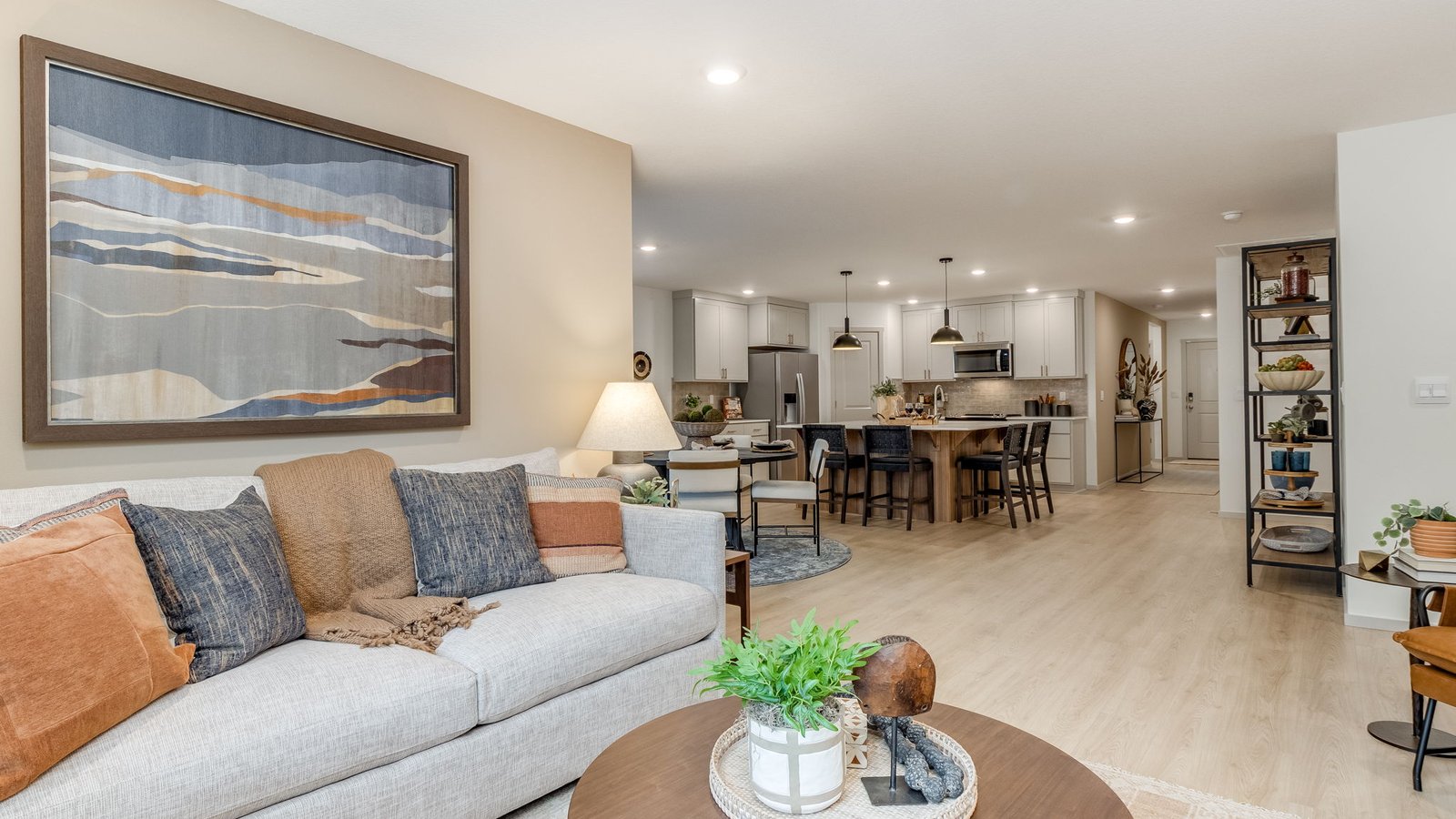 Great room with laminate flooring and an electric fireplace