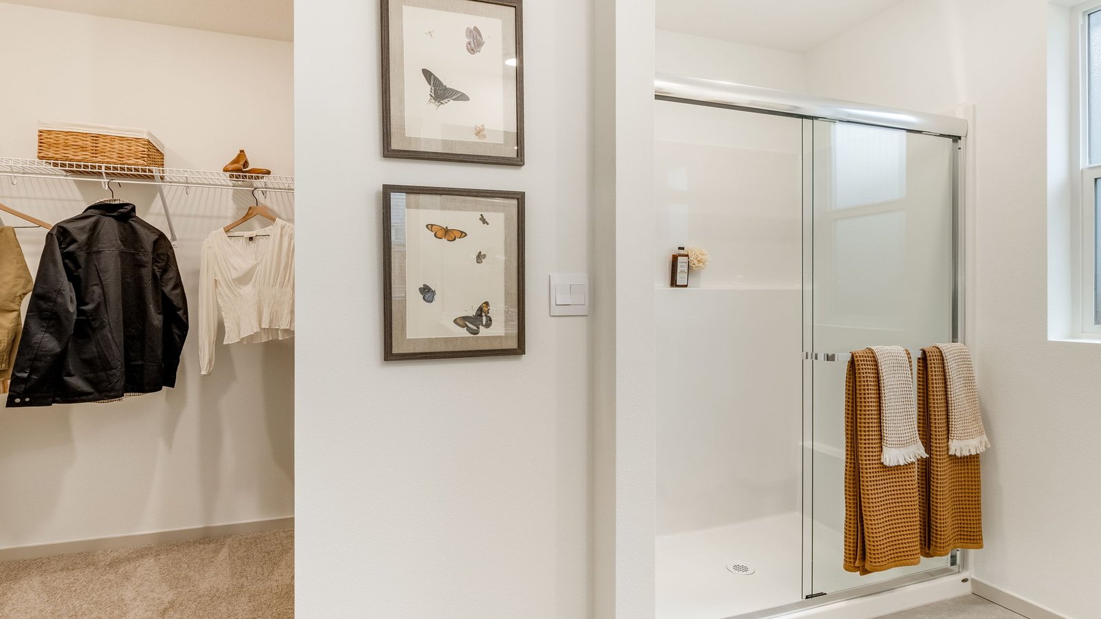 Primary bathroom with quartz counters and a walk-in shower