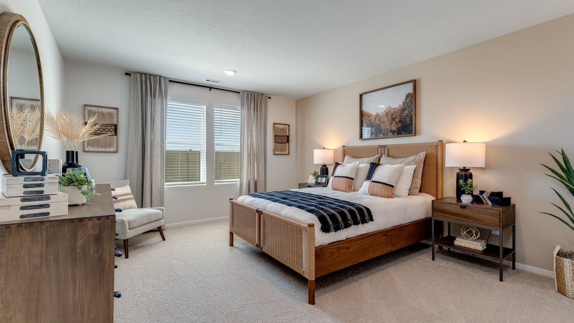 Primary bedroom with wall-to-wall carpet, a walk-in closet and an attached bathroom