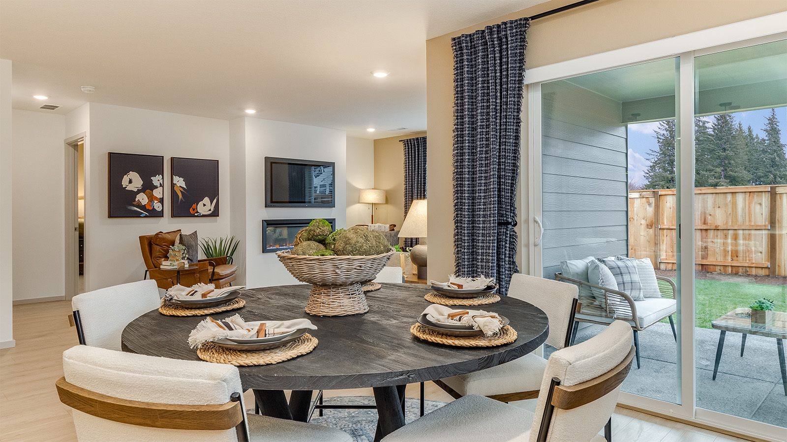 Dining area with a sliding glass door to a fenced backyard