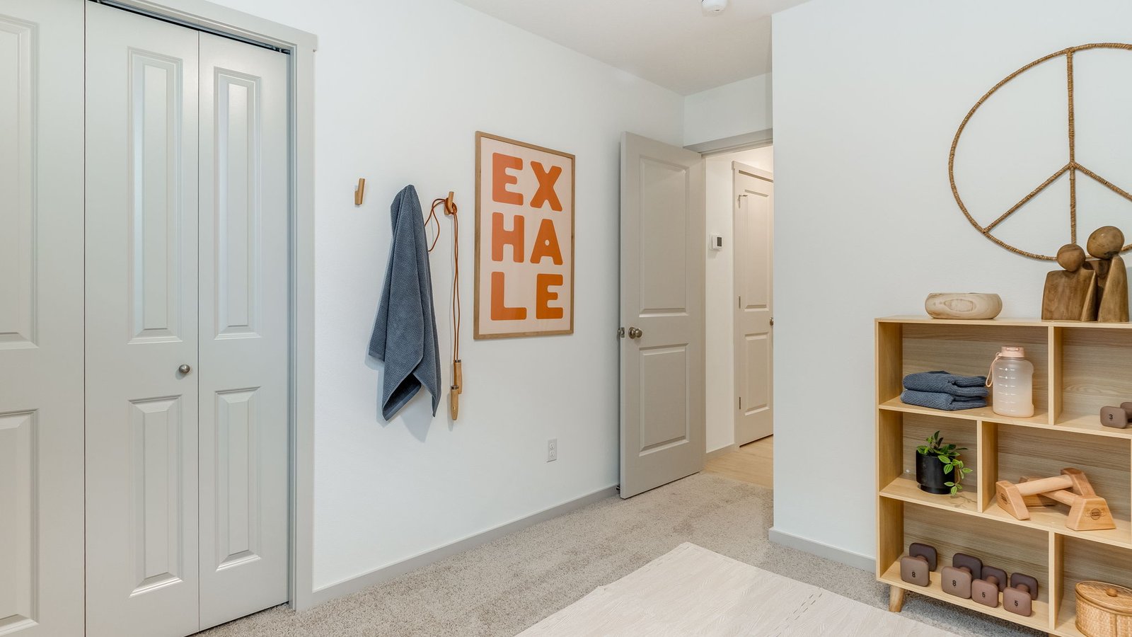 Bedroom with wall-to-wall carpet and a closet
