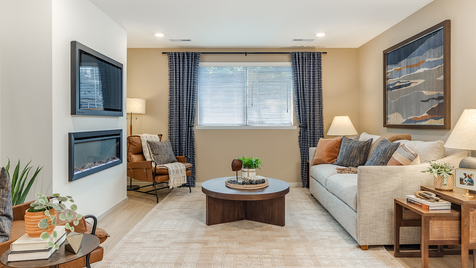 Great room with laminate flooring and an electric fireplace