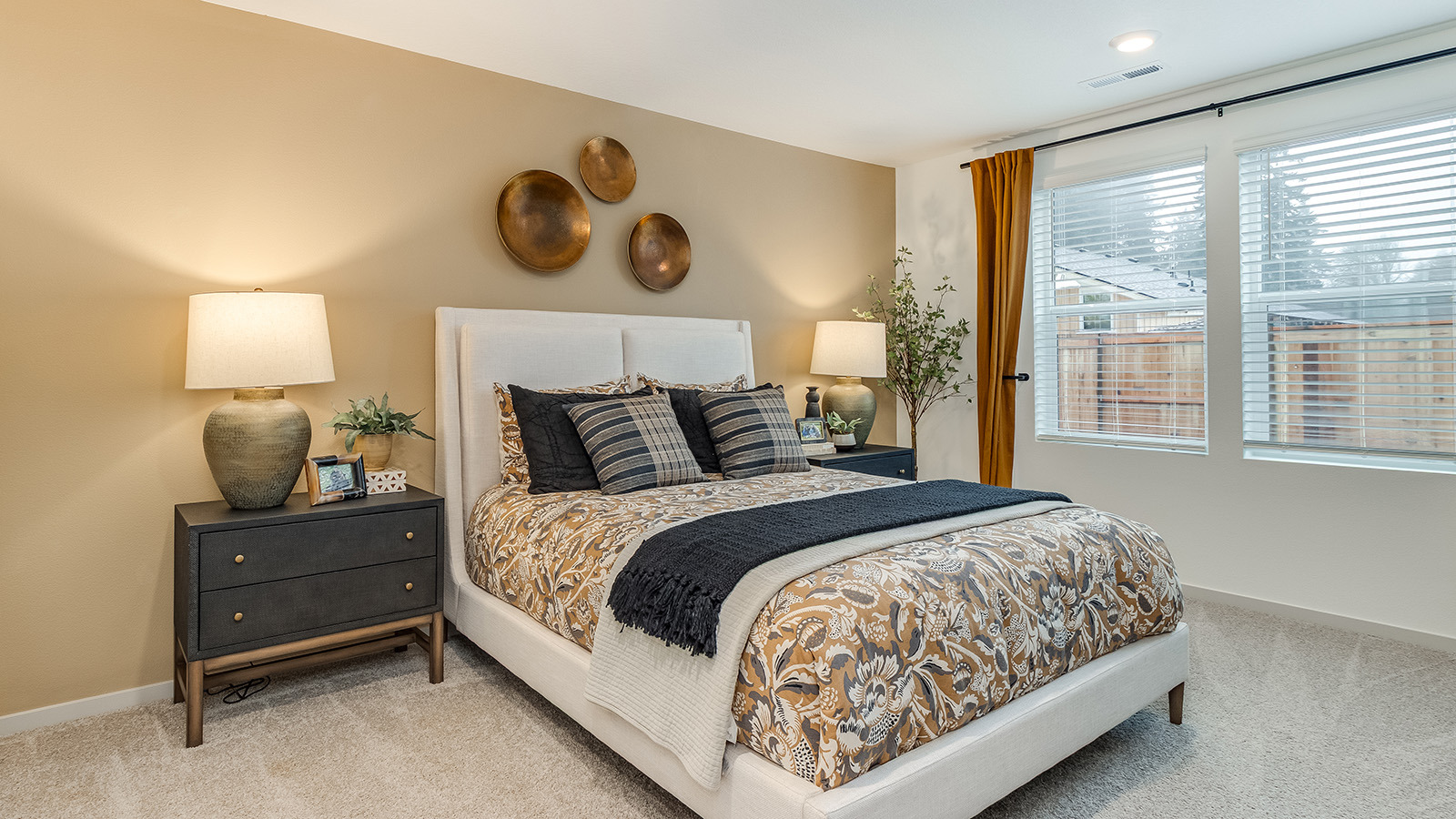 Primary bedroom with wall-to-wall carpet, a walk-in closet and an attached bathroom