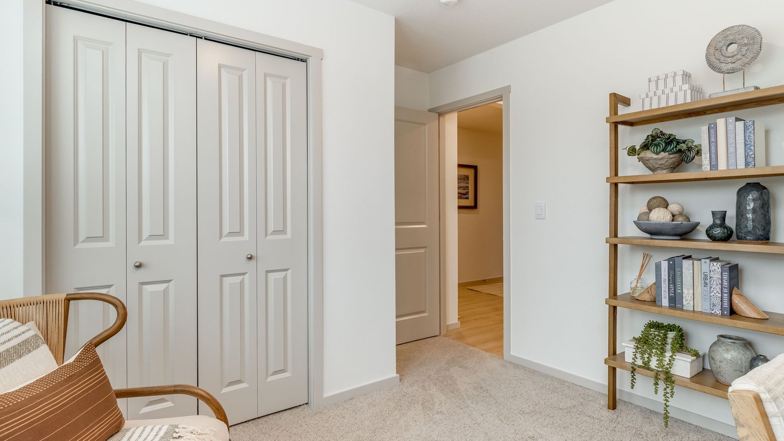 Bedroom with wall-to-wall carpet and a closet