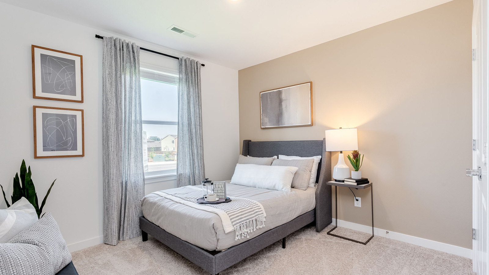 Bedroom with wall-to-wall carpet and a closet