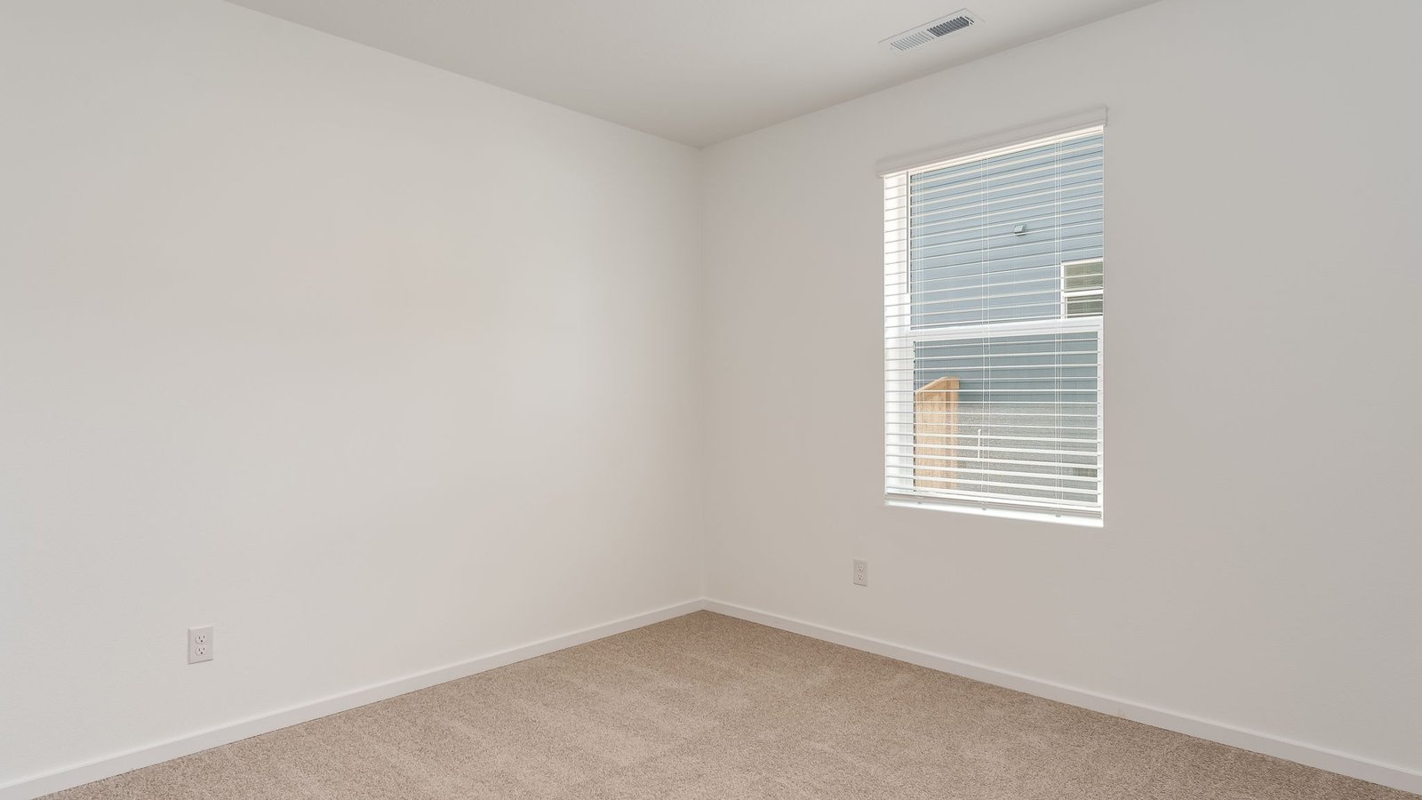 Bedroom with wall-to-wall carpet and a closet