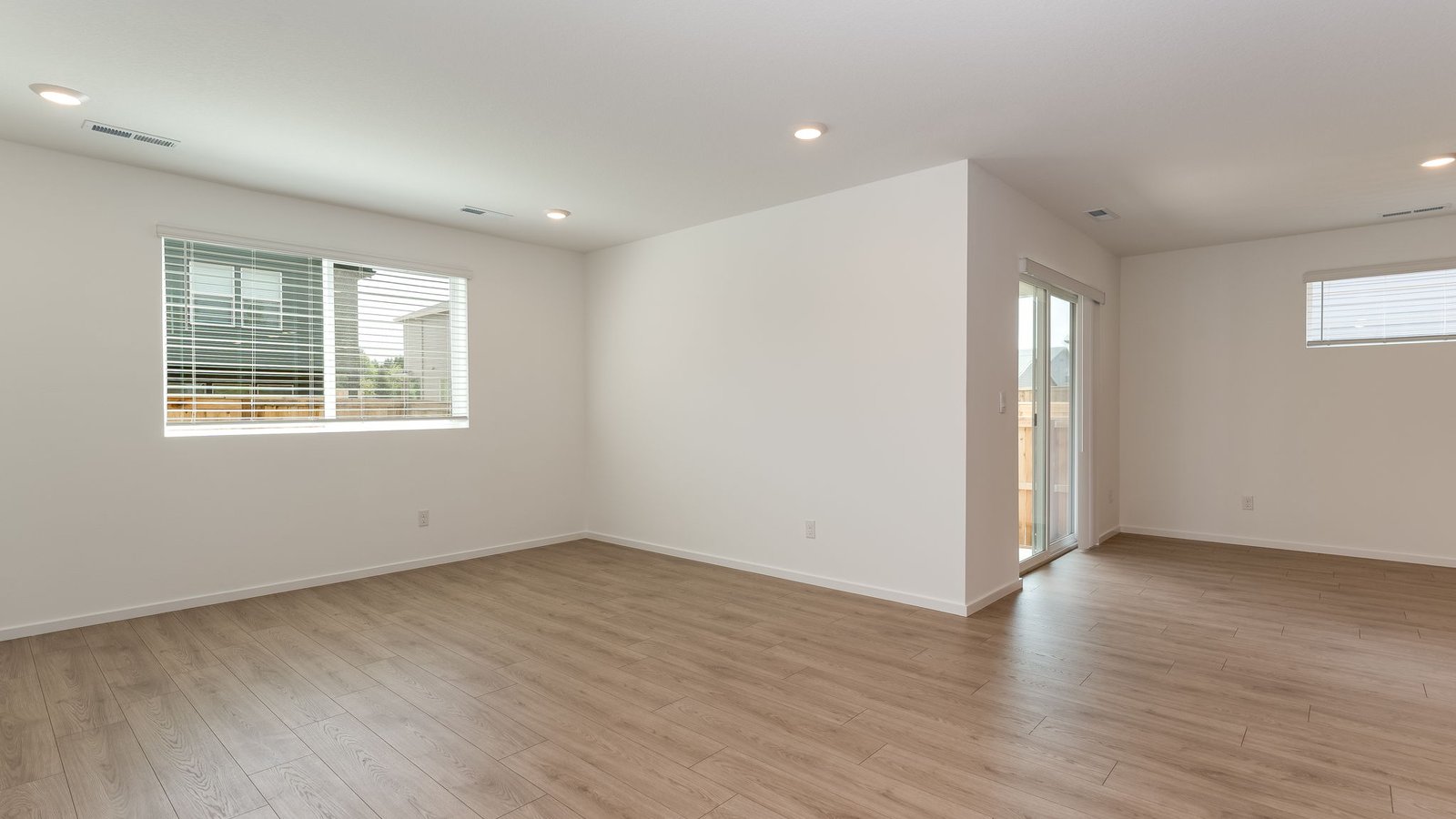 Great room with laminate flooring and an electric fireplace