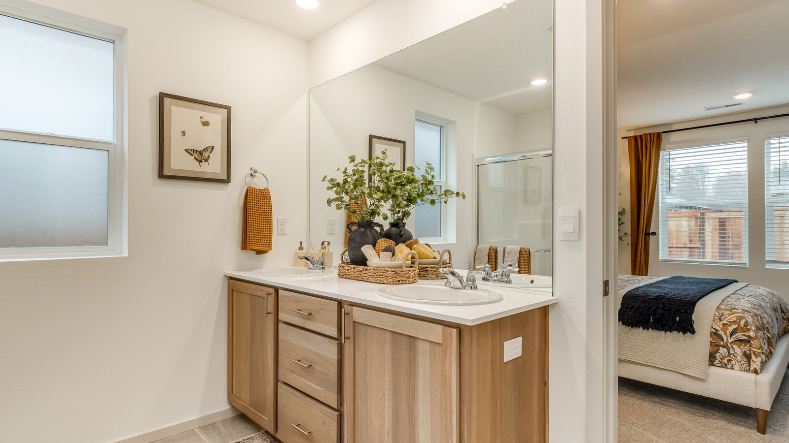 Primary bathroom with quartz counters and a walk-in shower