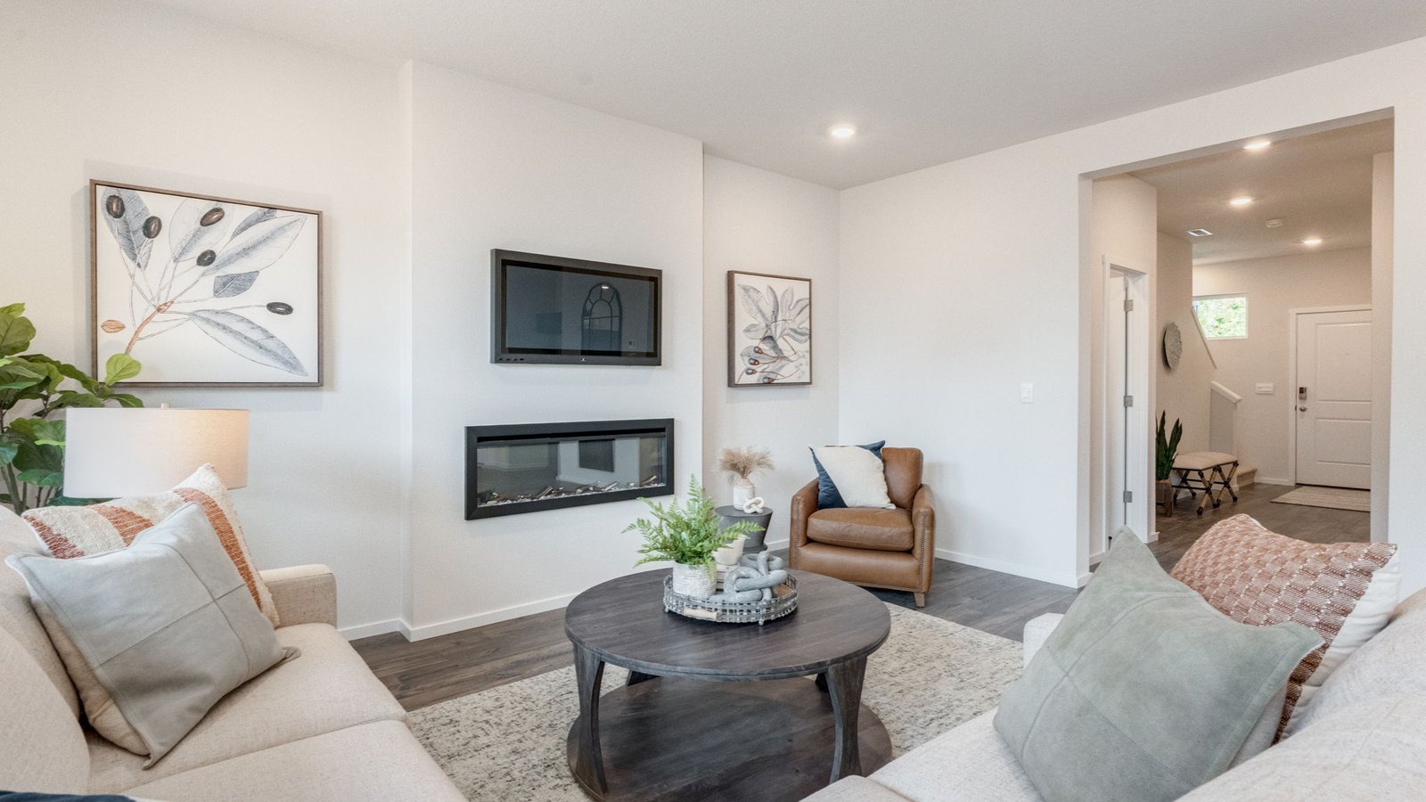 Great room with laminate flooring and an electric fireplace