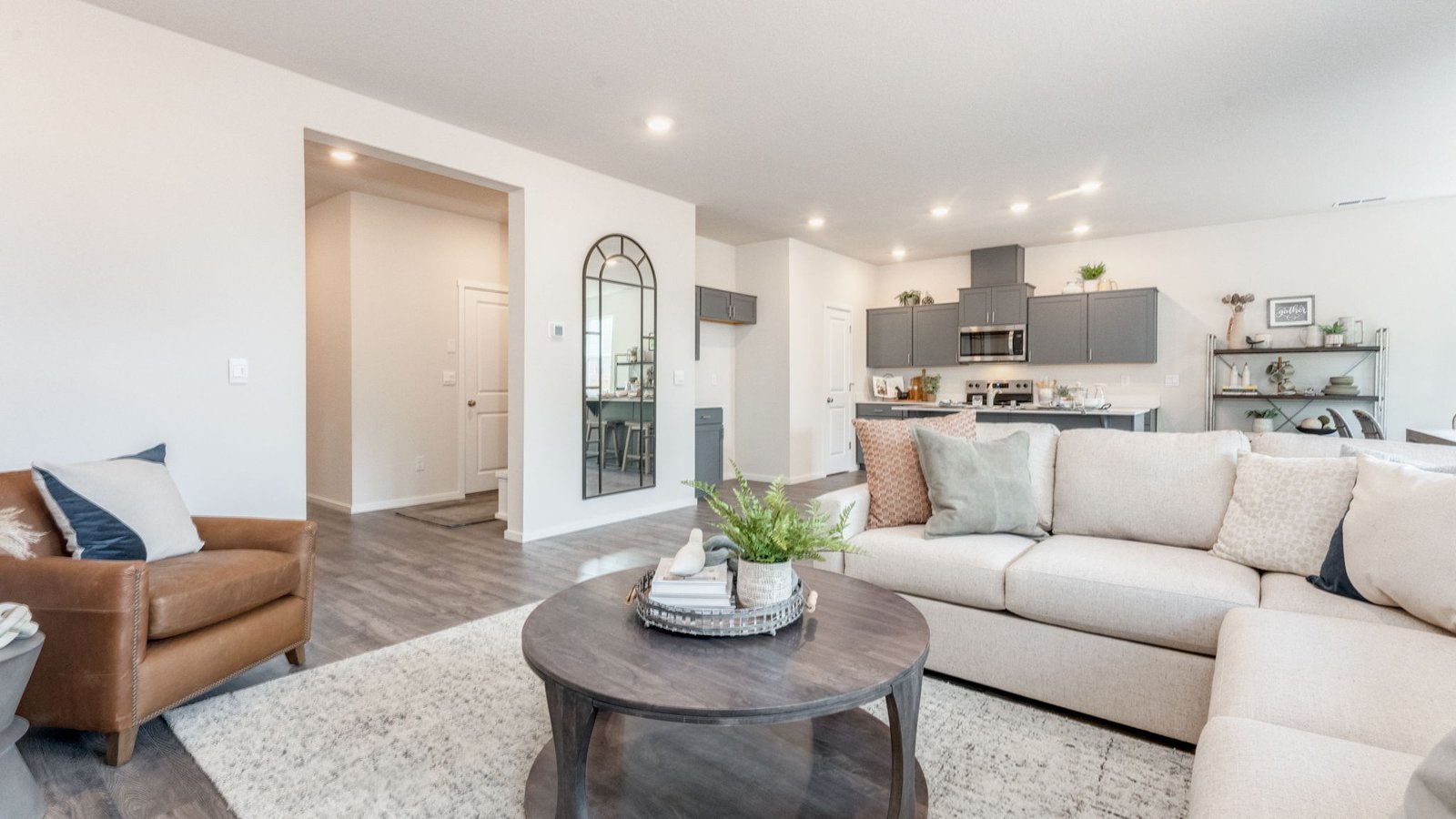 Great room with laminate flooring and an electric fireplace