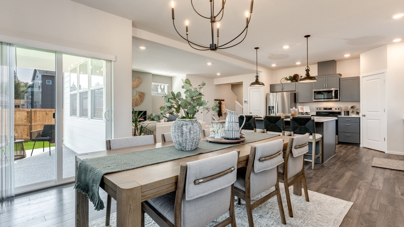 Dining area with a sliding glass door to a fenced backyard