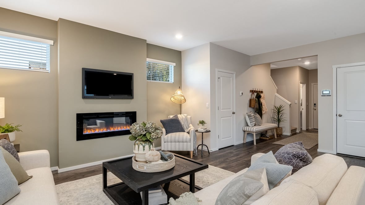 Great room with laminate flooring and an electric fireplace