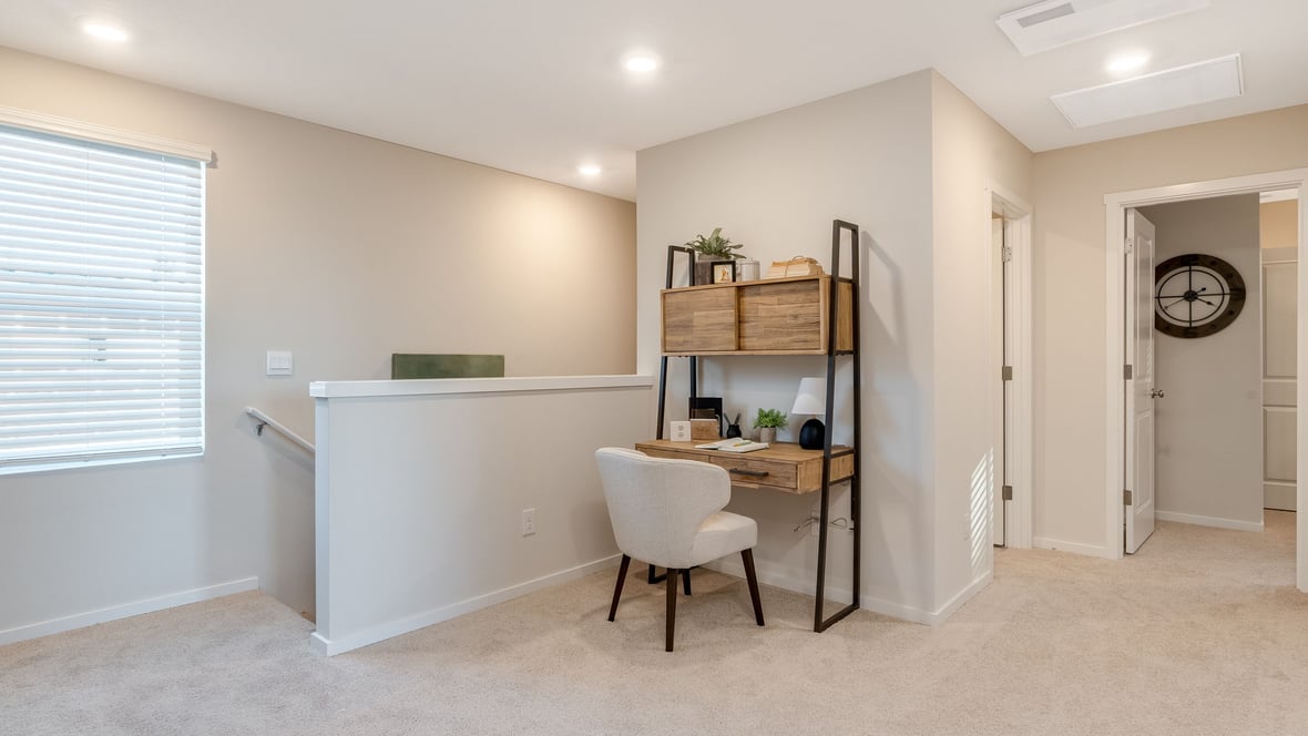 Hallway with wall-to-wall carpet