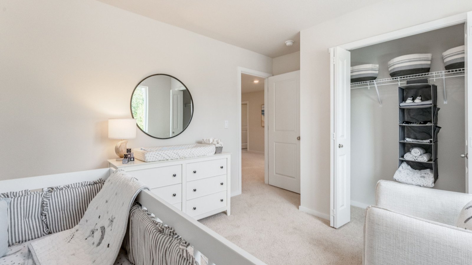 Bedroom with wall-to-wall carpet and a closet