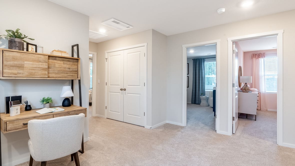 Hallway with wall-to-wall carpet