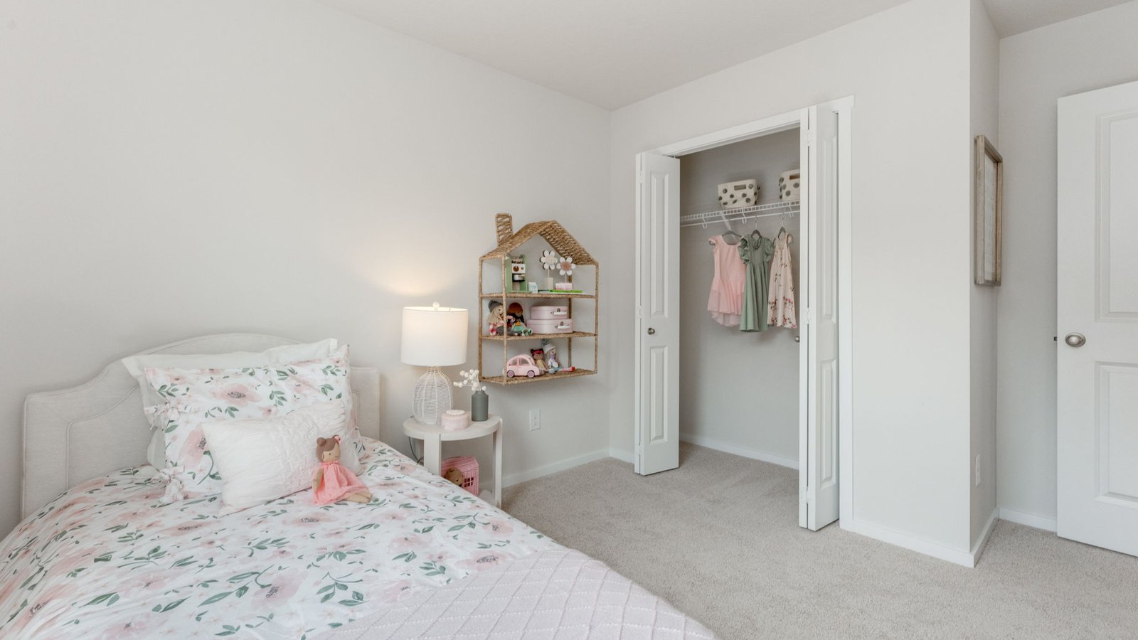 Bedroom with wall-to-wall carpet and a closet
