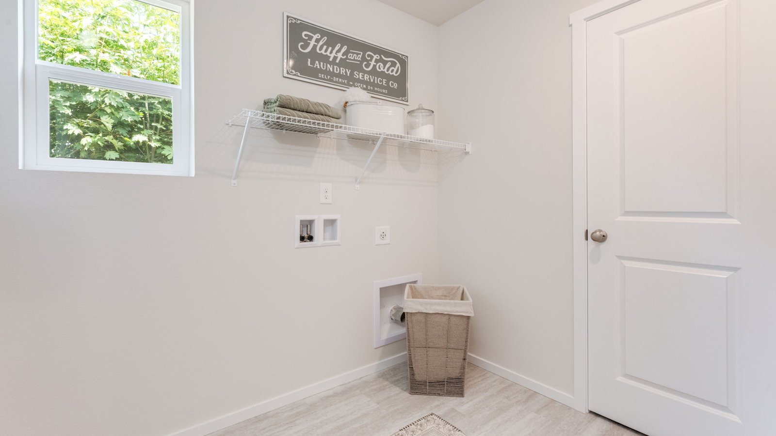 Laundry room with wire shelves and washer and dryer hookups