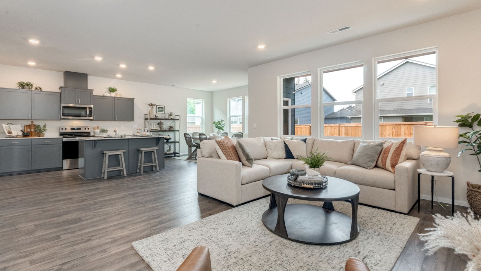 Great room with laminate flooring and an electric fireplace
