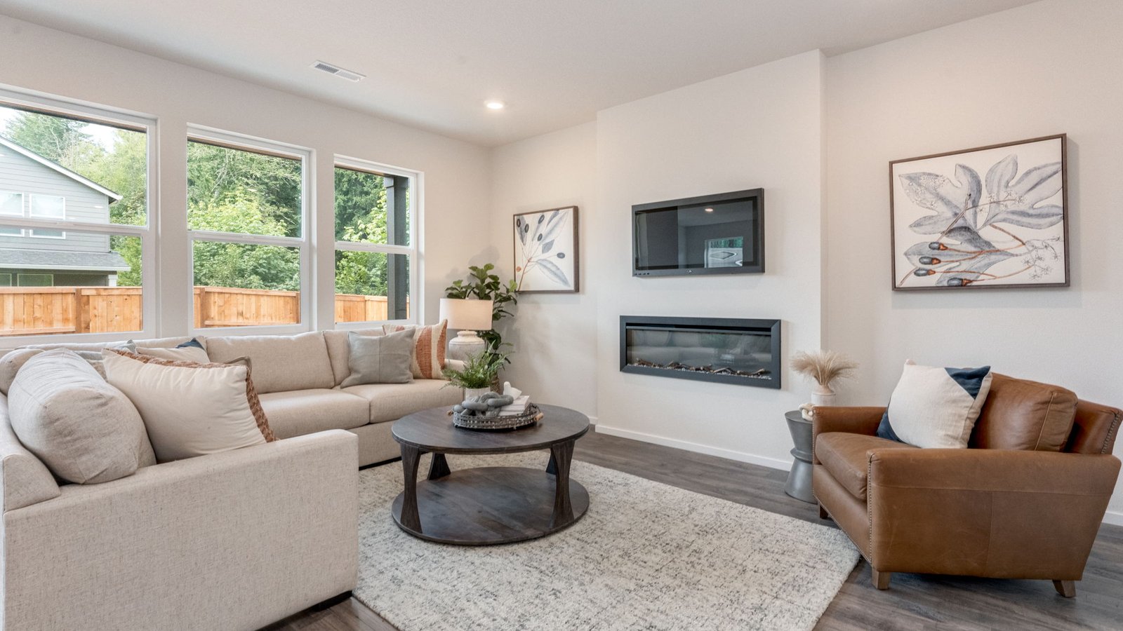 Great room with laminate flooring and an electric fireplace