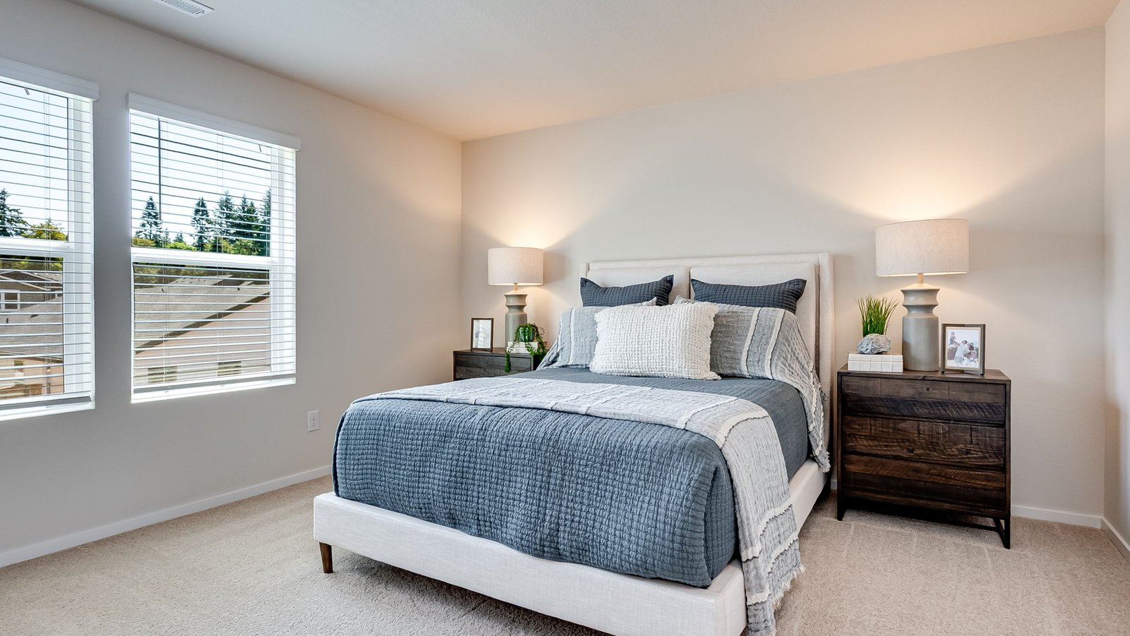 Primary bedroom with wall-to-wall carpet, a walk-in closet and an attached bathroom